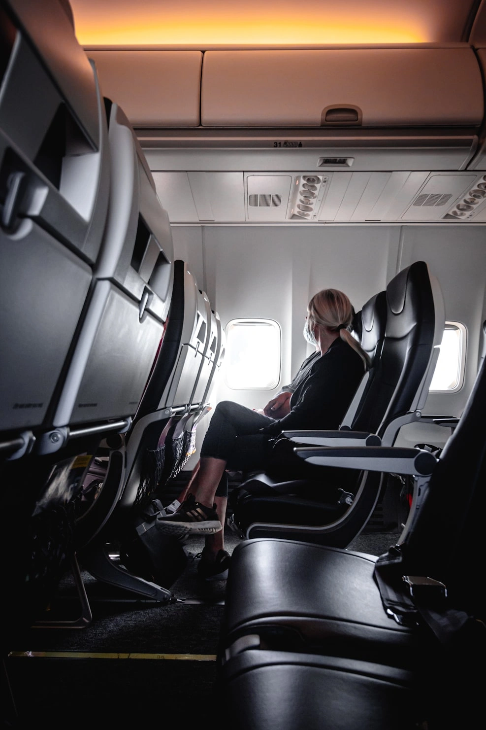 a girl on american airlines basic economy seats