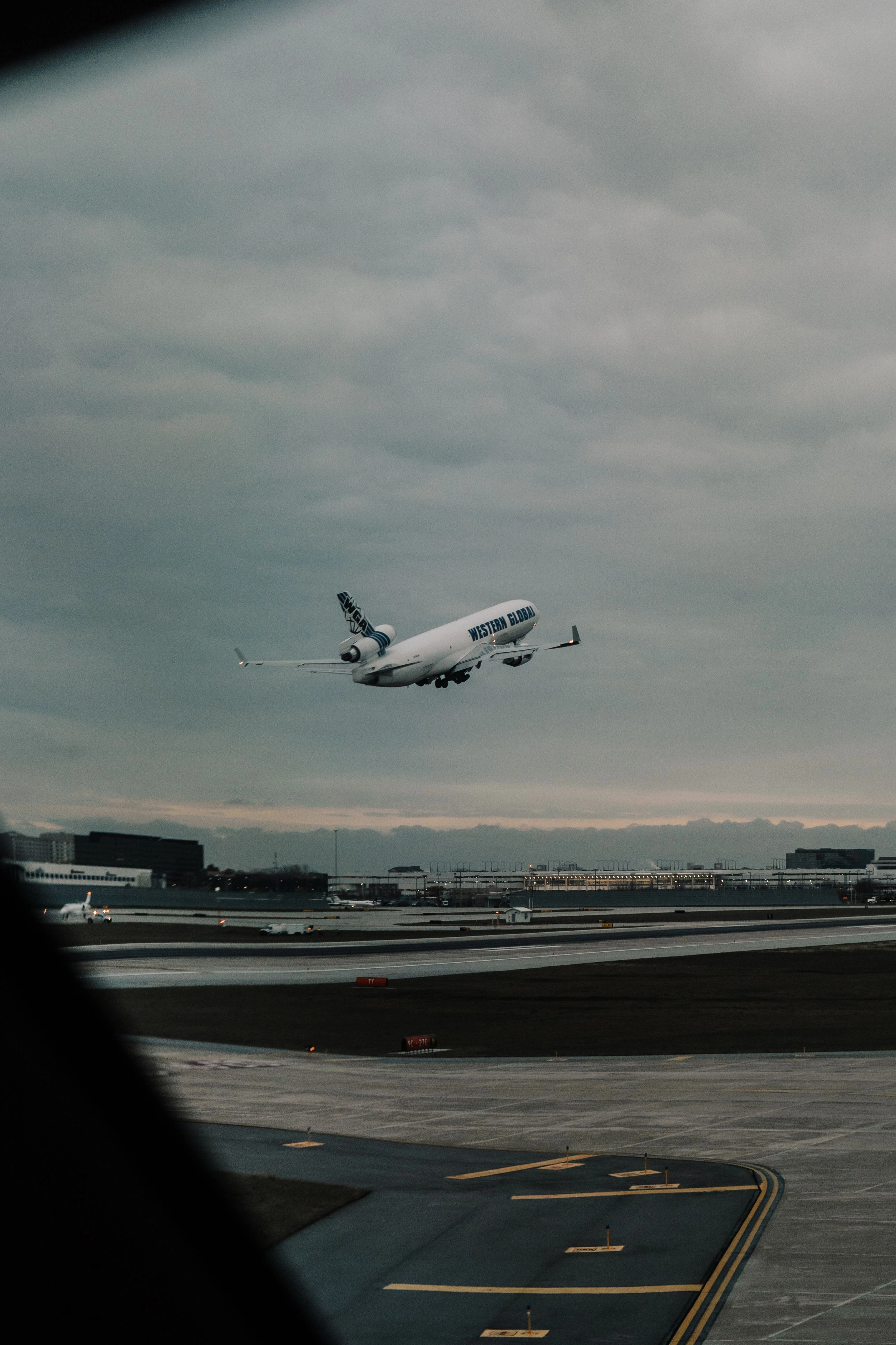 Airplane taking off from runway on a cloudy day, showcasing aviation and transportation at chicago international airport