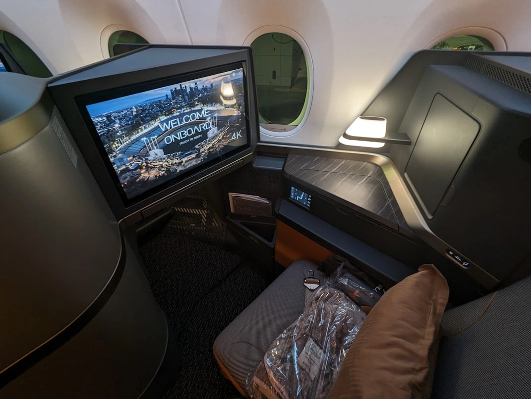 business class seat with luxury private screen on board flight