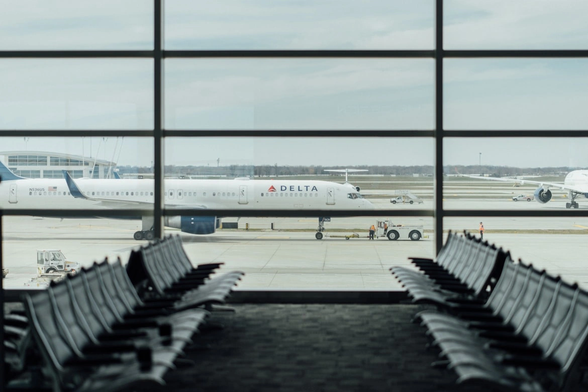 delta airlines basic business class frequent flyers at airport terminal