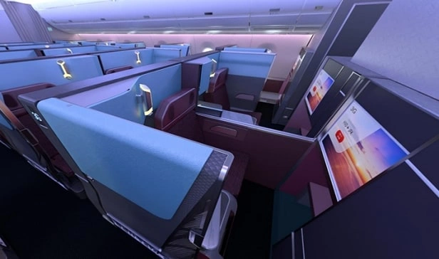jal business class seat with privacy suite with burgundy leather seating and personal entertainment screen