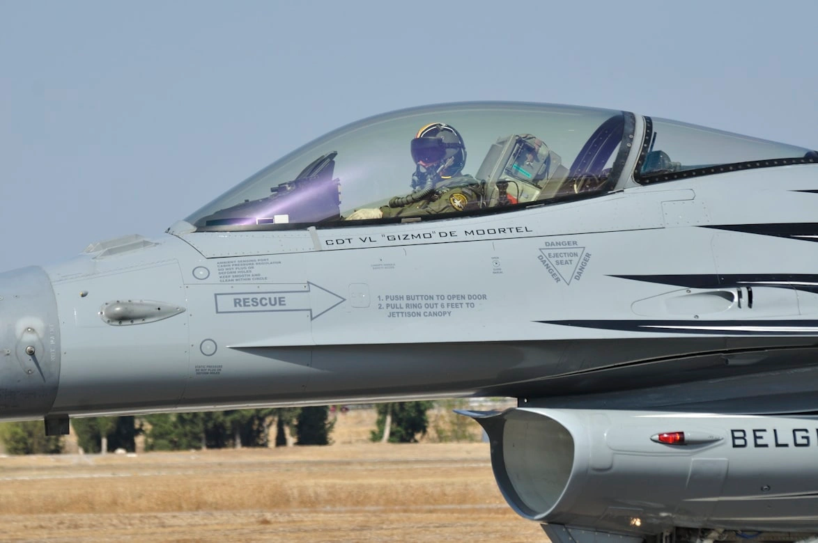 military pilot in a cockpit of a fighter jet ready to take off the ground