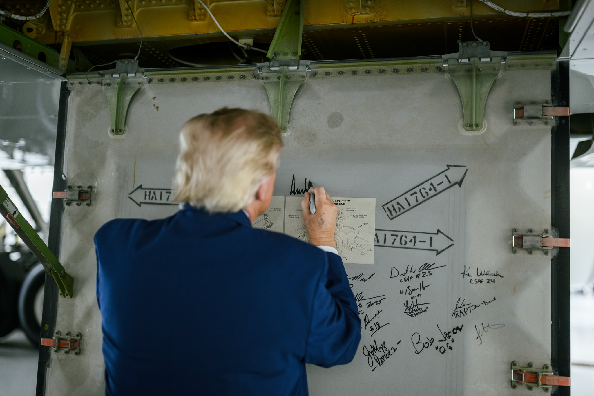 president donald trump signs his name on new air force one at Joint base andrews