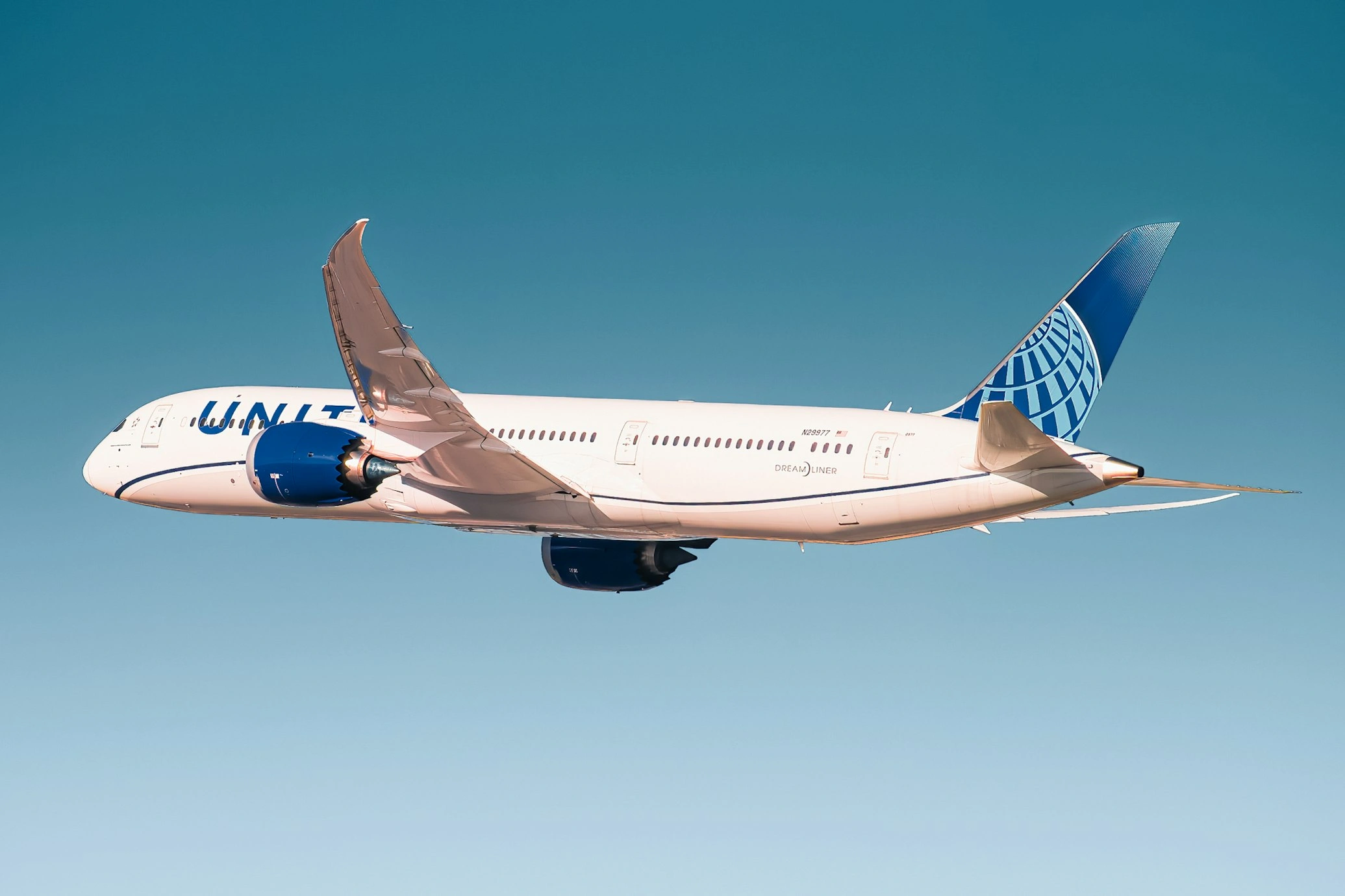 united airlines boeing-787 flying in the clear sky, san francisco usa